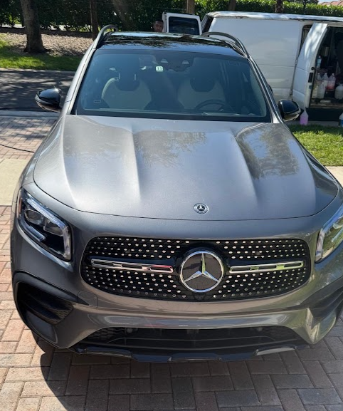 Grey Mercedes SUV with a clean, glossy hood after detailing